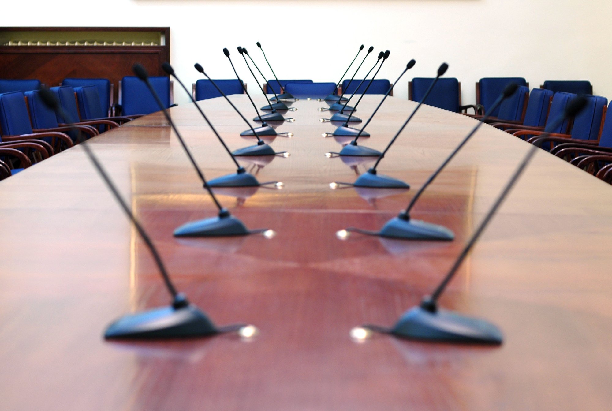 bigstock-Microphones-In-Empty-Conferenc-1098299